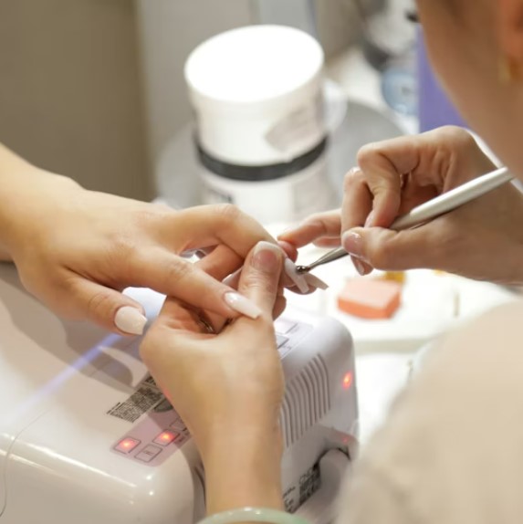 Minimalist nude gel manicure with thin gold line accent